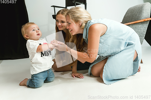 Image of Young family spending time together and smiling