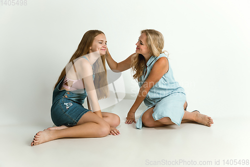 Image of Mom spending time with her daughter and smiling