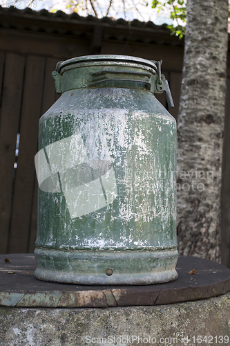 Image of Old metal milk can
