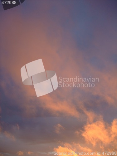Image of stratus clouds with orange reflection on sunset