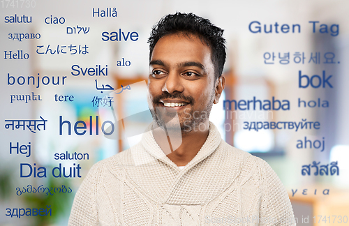 Image of indian man over words in foreign languages