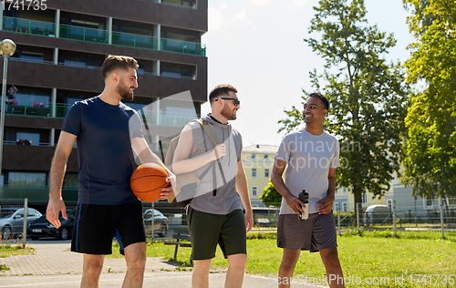 Image of group of male friends going to play basketball