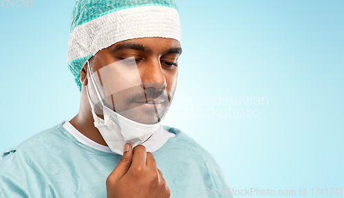 Image of face of sad doctor or surgeon with protective mask