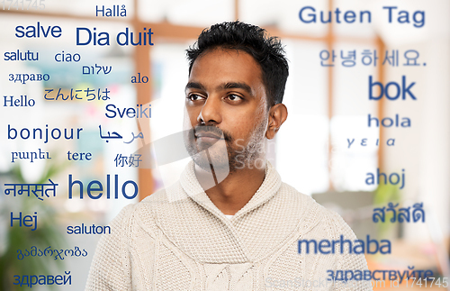 Image of indian man over words in foreign languages