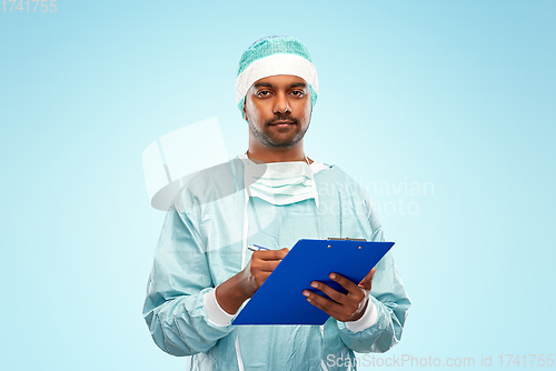 Image of indian male doctor or surgeon with clipboard