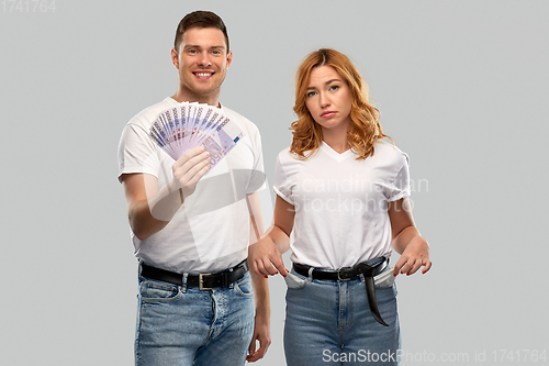 Image of couple with euro money and empty pockets