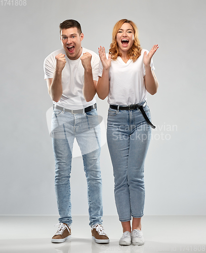 Image of portrait of happy couple in white t-shirts