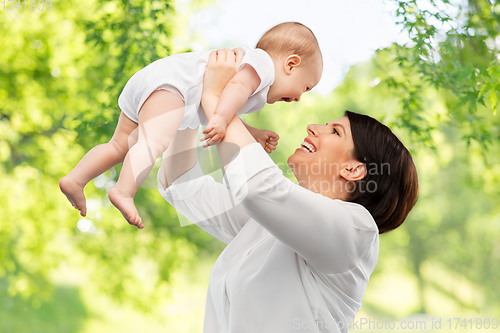 Image of happy middle-aged mother with little baby daughter