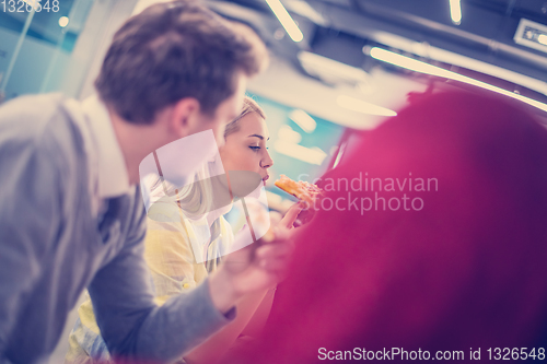 Image of multiethnic business team eating pizza