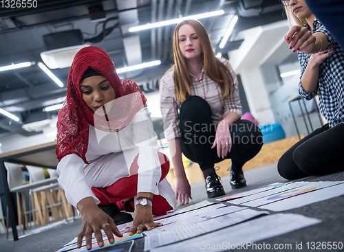 Image of black muslim woman having meeting with Multiethnic  startup busi