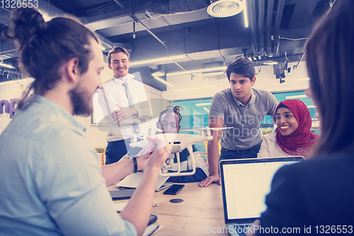 Image of multiethnic business team learning about drone technology