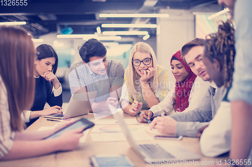 Image of Multiethnic startup business team having meeting