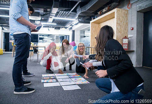 Image of black muslim woman having meeting with Multiethnic  startup busi