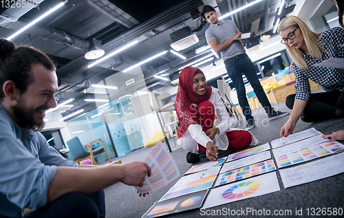 Image of black muslim woman having meeting with Multiethnic  startup busi