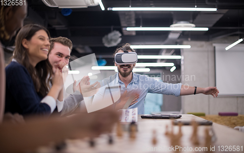 Image of Young Multiethnic Business team using virtual reality headset