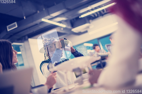 Image of Young Multiethnic Business team using virtual reality headset