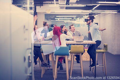 Image of Young Multiethnic Business team using virtual reality headset