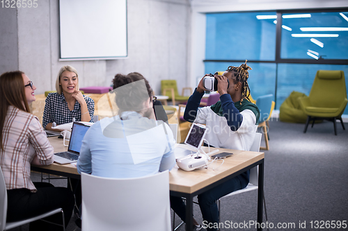 Image of Young Multiethnic Business team using virtual reality headset