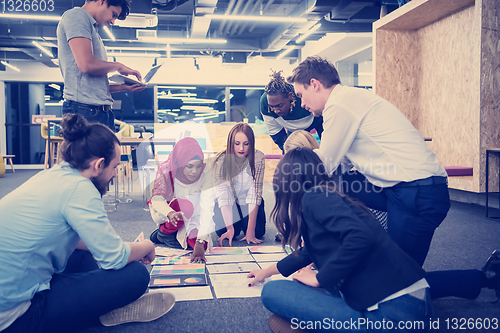 Image of black muslim woman having meeting with Multiethnic  startup busi