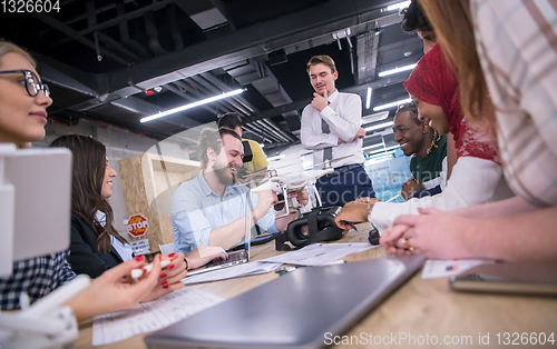 Image of multiethnic business team learning about drone technology