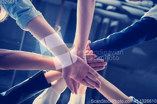 Image of multiethnic Group of young business people celebrating success