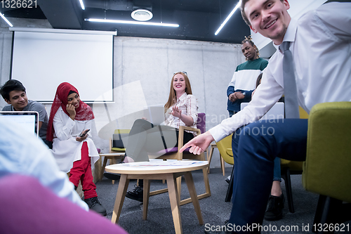 Image of Multiethnic startup business team having meeting