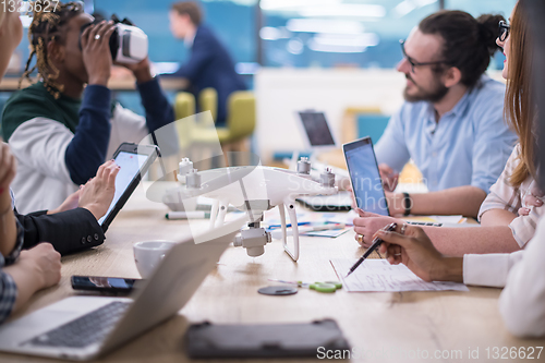 Image of Young Multiethnic Business team using virtual reality headset