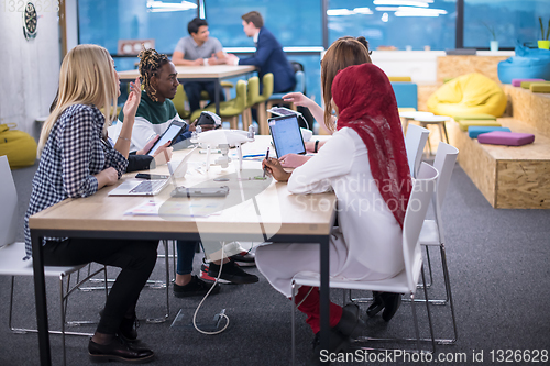 Image of multiethnic business team learning about drone technology