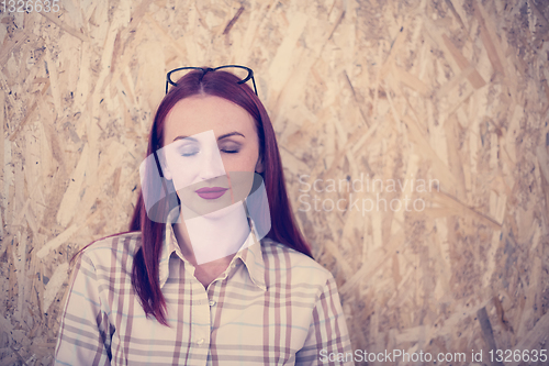 Image of portrait of young redhead business woman