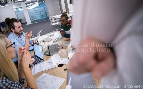 Image of multiethnic business team learning about drone technology