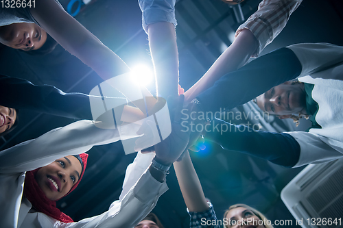 Image of multiethnic Group of young business people celebrating success