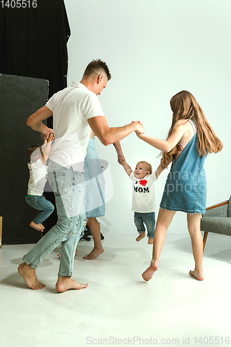 Image of Young family spending time together and smiling