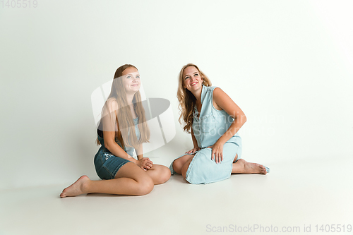 Image of Mom spending time with her daughter and smiling