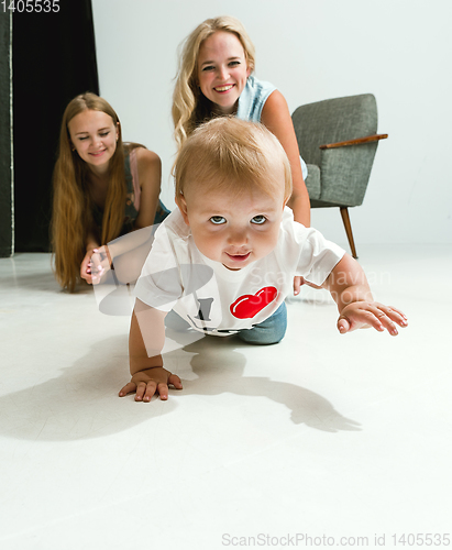 Image of Young family spending time together and smiling