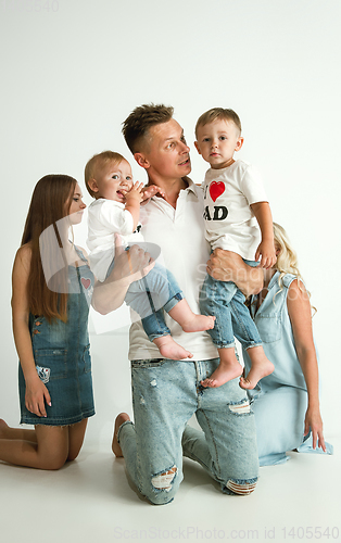 Image of Young family spending time together and smiling