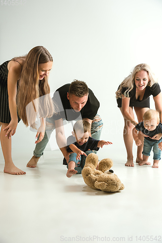 Image of Young family spending time together and smiling