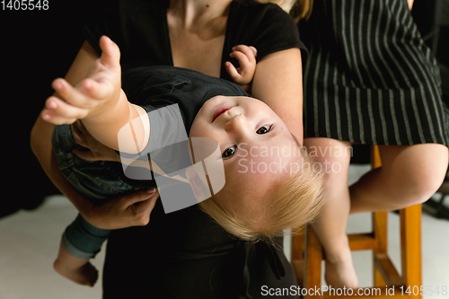 Image of Young family spending time together and smiling