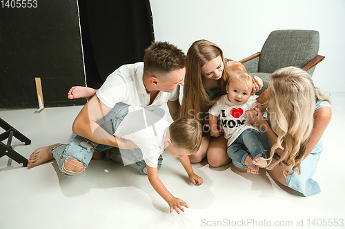 Image of Young family spending time together and smiling