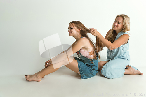 Image of Mom spending time with her daughter and smiling