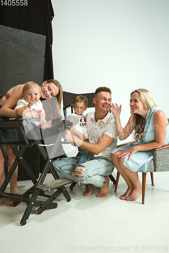 Image of Young family spending time together and smiling