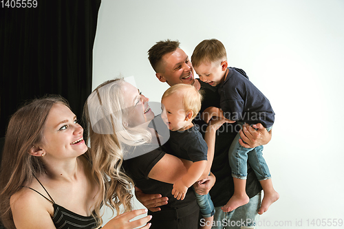 Image of Young family spending time together and smiling