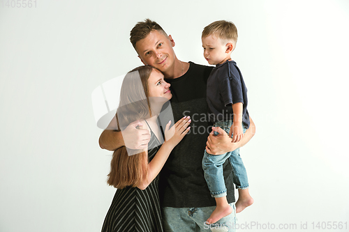 Image of Young family spending time together and smiling