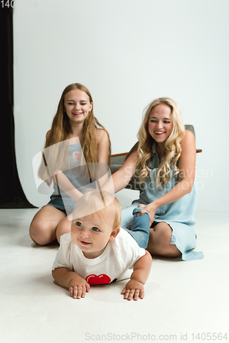 Image of Young family spending time together and smiling