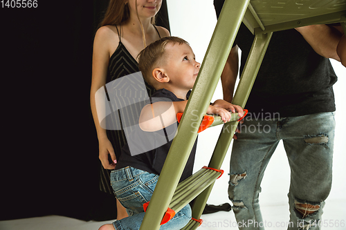 Image of Young family spending time together and smiling