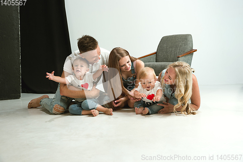 Image of Young family spending time together and smiling