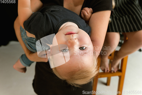 Image of Young family spending time together and smiling