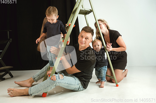 Image of Young family spending time together and smiling