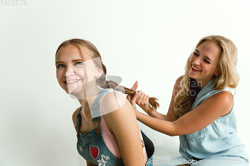 Image of Mom spending time with her daughter and smiling