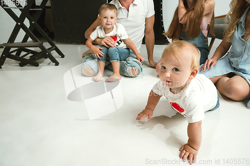 Image of Young family spending time together and smiling