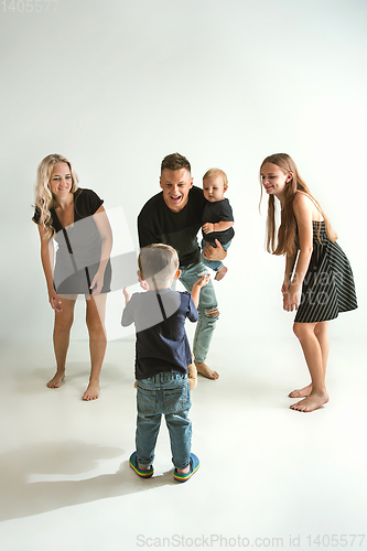 Image of Young family spending time together and smiling